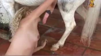 Nude blond babe shoves enormous horse cock into her hairy pussy